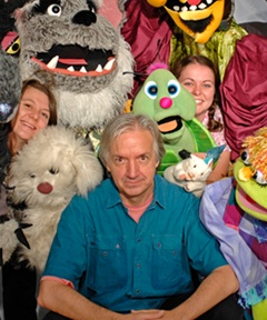 John Lewandowski surrounded by his work