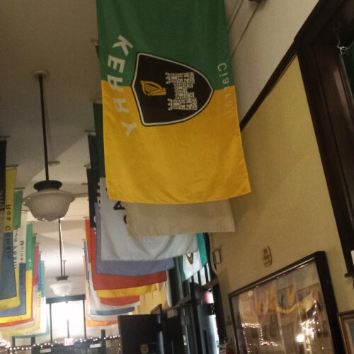 In the Irish Heritage Center's entry foyer, flags representing all of Ireland's 32 counties hang overhead.