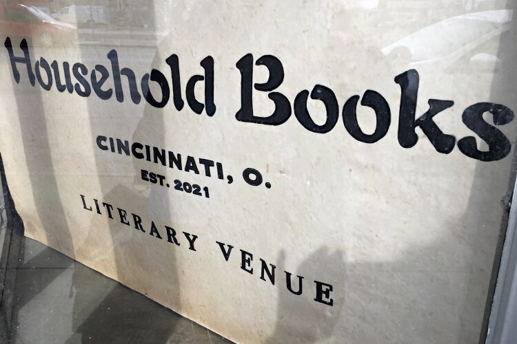 The window of Household Books displays a simple sign using the intentionally-selected elegant and somewhat old fashioned Globe font.