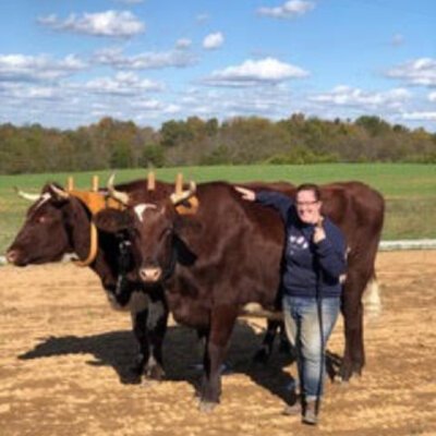 Rachel with her oxen team that she raised from calves. She made the yoke as a course project.