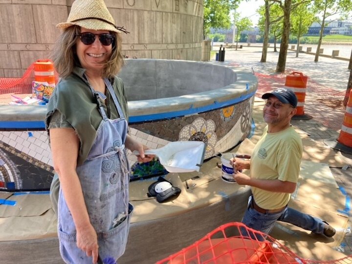 Suzanne Fisher and Sergio Contreras install Suzanne's mosaic band.