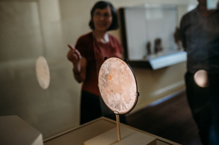 On the back of the mirror are six Chinese letters, which spell the name Amitabha Buddha.