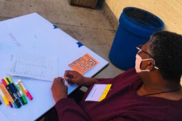 Elizabeth Burnside from the Storefronts Community Arts Squad collects community input for IA redesign.