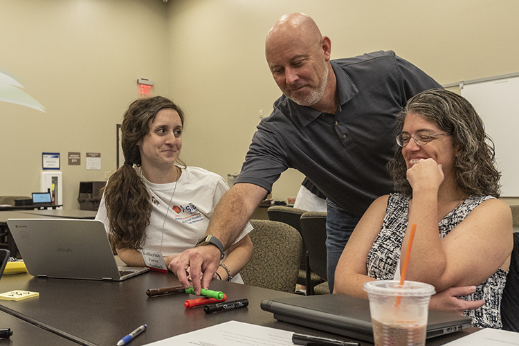 L to R Katherine Power Morelock, presenter David Clark, Michelle Kozlowski