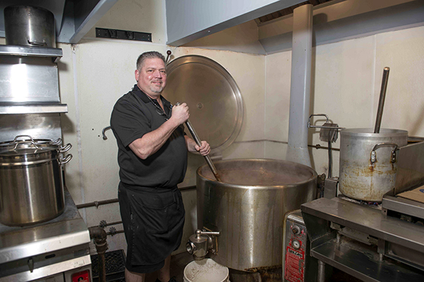 Steve Beltsos mixes a fresh batch of chili in Price Hill.