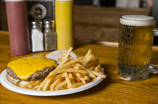 A classic cheeseburger, fries and a beer at Quatman CafÃ©