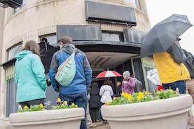 Attendees gather outside Paramount Building for March's "Walk McMillan with the McDevvitts."