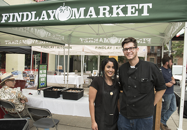 Mandira Jacob of Oh Little Mustard Seed and Tyler Retyi-Gazda, co-founder of Grind on the Rhine, both utilize space at Findlay Kitchen. Jacob's catering and events company specializes in South Indian cuisine, while Retyi-Gazda and his business partner Josh Dickerson serve up grinder sandwiches on weekends at Findlay Market.