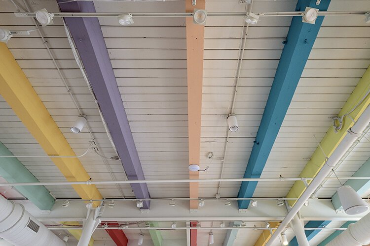 ArtWorks had originally planned to paint the first-floor ceiling crossbeams black, but the restoration revealed Bolce-Era pastel colors that inspired the organization to tip its cap to the building’s legacy.