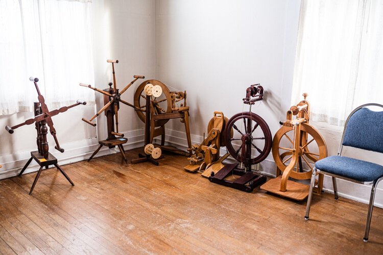 There is a room of spinning wheels at “The Guild House.” 