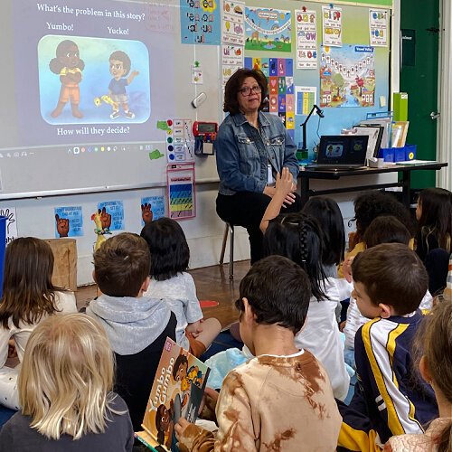 Dawson leads a group of elementary students during a school visit at Larchmont Charter School in Los Angeles.