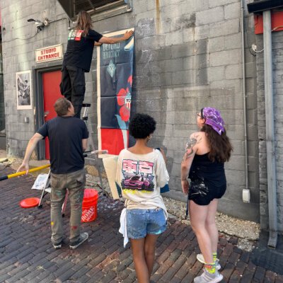 Temporary wheatpaste murals are a signature of Shepard Fairey.