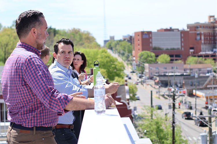 Cincinnati Regional Chamber Leadership Cincinnati class 47 taking in the south and west views from the CCAC rooftop.