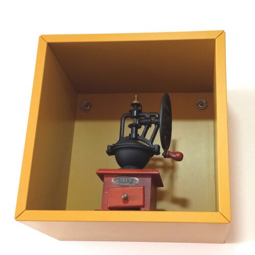 This antique coffee grinder on display at Unataza reflects the shop's handsome decor and devotion to quality coffee.