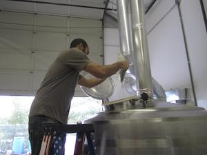 Brian Jackson, founder and CEO, brewing a beer.