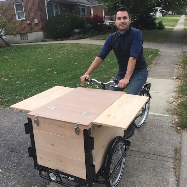Aaron Greene with the prototype of his mobile science lab, It's Just Science.