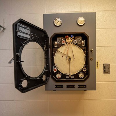"Rabbit timer" device for feeding and climate control of lab rabbits for up to a month.
