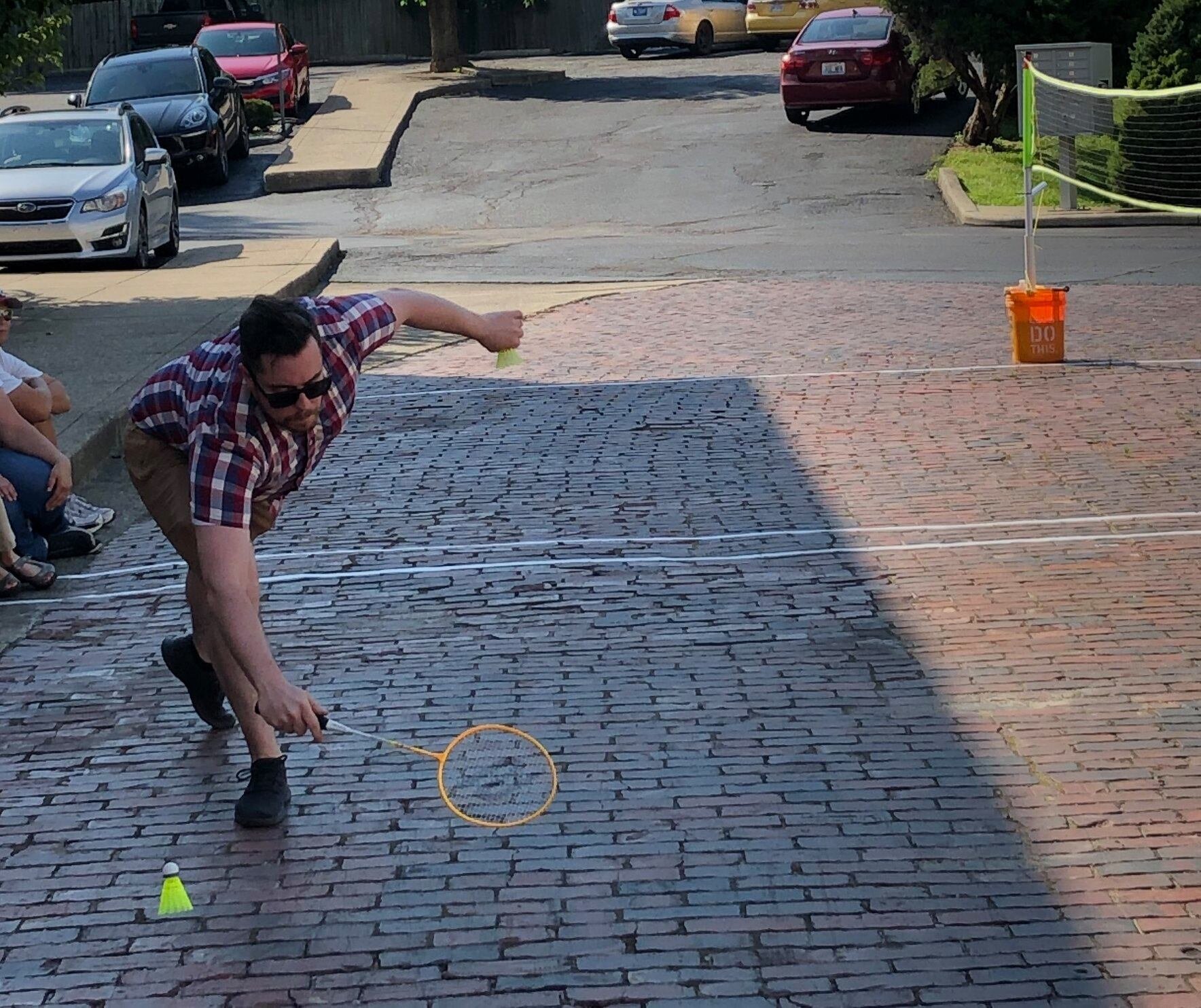 Covington's historic brick streets add challenge to the Brawl's badminton court.